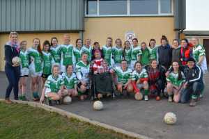 Aghada Junior Ladies with their biggest supporter Martin Coleman