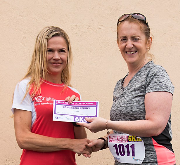 Anna-Marie Barry of Fermoy print presenting Dolores Duffy (Watergrasshill AC) with first prize.