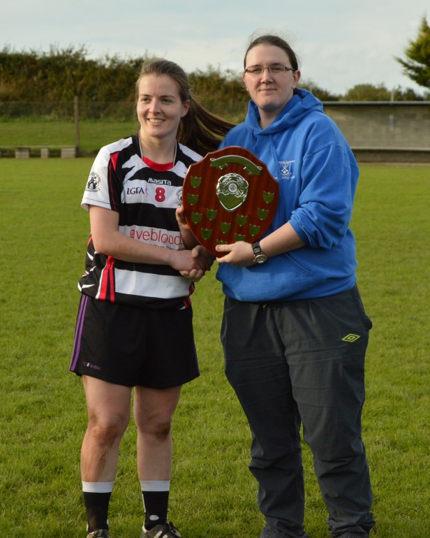 Our inspirational captain Ciara accepting the Phil McCarthy Trophy from Phil
